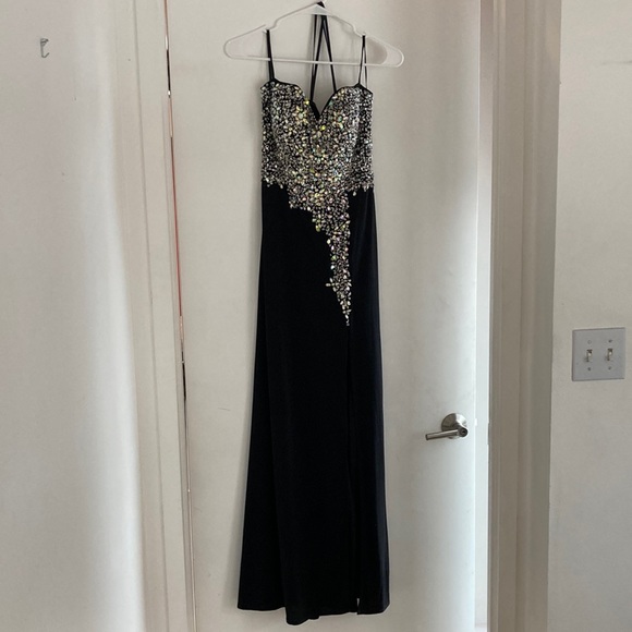 Crystal Doll Dresses & Skirts - Long bejeweled black prom dress with thin straps and slit up to the thigh.